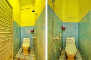 two toilets in a bathroom with yellow and blue tiles at SPOT ON 91540 Ukuh Guesthouse in Prambanan