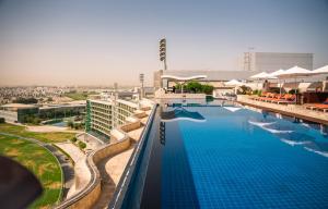 an overhead view of a swimming pool at a hotel at The Meydan Hotel Dubai in Dubai