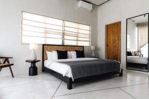 Ένα ή περισσότερα κρεβάτια σε δωμάτιο στο Villa Umami