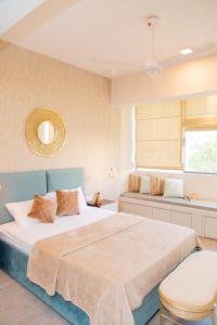 a bedroom with a large bed and a window at ARON'S Lavinia SAPPHIRE in Mount Lavinia