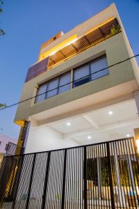 a house with a fence in front of it at ARON'S Lavinia SAPPHIRE in Mount Lavinia