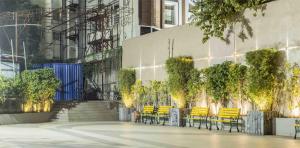 a group of tables and chairs in front of a building at The Citi Residenci Hotel - Durgapur in Durgāpur