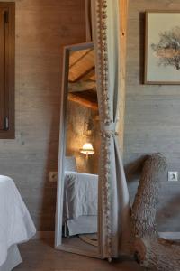 A bed or beds in a room at Stolidi Mou Treehouse