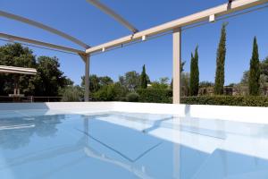 The swimming pool at or close to Stolidi Mou Treehouse