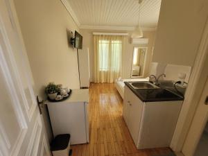 a kitchen with a sink and a counter top at Villa Petros in Nydri +46 photos