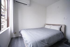 Postel nebo postele na pokoji v ubytování ZAITO Tokyo Skytree-Yokokawa II Studio 天空树旁舒适型民宿-宅东横II号店
