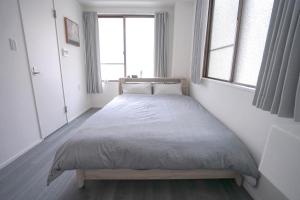 Postel nebo postele na pokoji v ubytování ZAITO Tokyo Skytree-Yokokawa II Studio 天空树旁舒适型民宿-宅东横II号店