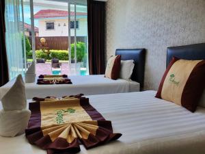 Postel nebo postele na pokoji v ubytování Retreat Resort Pattaya