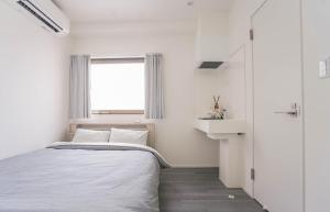 Postel nebo postele na pokoji v ubytování ZAITO Tokyo Skytree-Yokokawa II Studio 天空树旁舒适型民宿-宅东横II号店