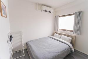 Postel nebo postele na pokoji v ubytování ZAITO Tokyo Skytree-Yokokawa II Studio 天空树旁舒适型民宿-宅东横II号店