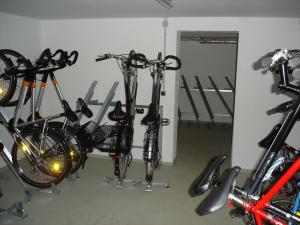 a group of bikes parked in a garage at Haus Bucheneck App 07 in Graal-Müritz
