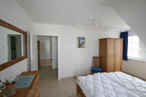 Ένα ή περισσότερα κρεβάτια σε δωμάτιο στο Villa Friederike App 05 - Flaschenpost