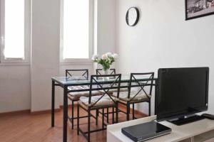 Televízia a/alebo spoločenská miestnosť v ubytovaní SV18C Charming modern flat S Ambrogio