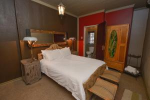 Ένα ή περισσότερα κρεβάτια σε δωμάτιο στο La Rochelle Guesthouse