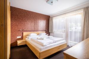 Posteľ alebo postele v izbe v ubytovaní Apartments Tschanun