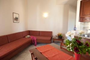 a living room with a couch and a table at Lito Beach Hotel in Gerani Chanion