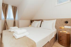 Postel nebo postele na pokoji v ubytování Trecento Boutique Rooms + 37 fotografií