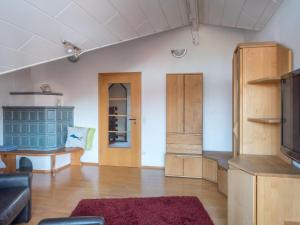 a living room with a couch and a table at Ferienwohnung Denn in Langenargen