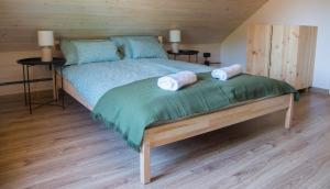 a bedroom with a bed with two pillows on it at Sominkowe Wzgórze in Sominy