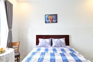 Giường trong phòng chung tại Ruby Hotel - Tân Uyên - Bình Dương