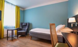 Postel nebo postele na pokoji v ubytování Thon Hotel Linne