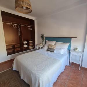 Łóżko lub łóżka w pokoju w obiekcie Casa M de mar - Dúplex con vistas