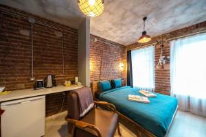 a bedroom with a bed and a desk in a room at Classy Furnished Studio in The Heart of Karaköy ( Karakoy 1 ) in Istanbul