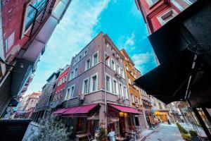 a tall building on a street in a city at Classy Furnished Studio in The Heart of Karaköy ( Karakoy 1 ) in Istanbul