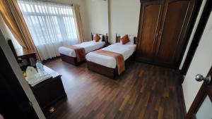 Cama o camas de una habitación en Pension Vasana Hotel