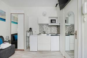 Kuchyňa alebo kuchynka v ubytovaní Comfortable studio - 2P - Grenelle