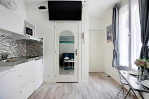Kuchyňa alebo kuchynka v ubytovaní Comfortable studio - 2P - Grenelle