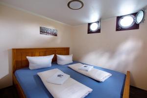 Letto o letti in una camera di Schiffsherberge Pöppelmann