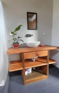 a bathroom counter with a sink and a bowl at Kalaloo Point in Providencia