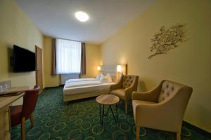 TV a/nebo společenská místnost v ubytování Hotel Tenner