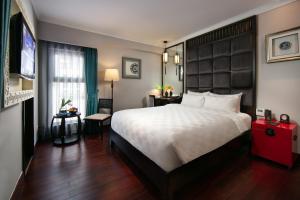 Postel nebo postele na pokoji v ubytování HOTEL du LAC Hanoi