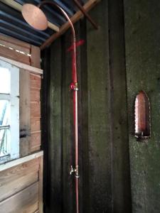a red hose hanging on the wall of a room at Lavendelmond Glamping in Barntrup