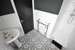 a bathroom with a sink and a toilet and a shower at Hesketh Villa - 4 Bedroom Seaside Holiday Home in Blackpool