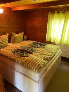 Ein Bett oder Betten in einem Zimmer der Unterkunft Naturpark Kanone