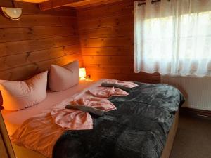 Ein Bett oder Betten in einem Zimmer der Unterkunft Naturpark Kanone