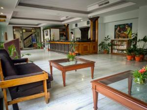 a living room with couches and tables at Pension Vasana Hotel in Kathmandu