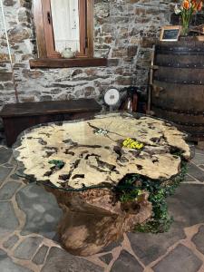 a table made out of a tree stump at Casa Regueirín in Lugo