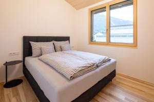 Postel nebo postele na pokoji v ubytování am Greben Apartments eins - zwei - sechs - sieben