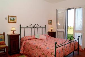 Postel nebo postele na pokoji v ubytování Agriturismo San Luigi