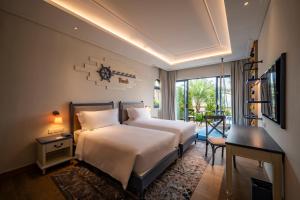 Ein Bett oder Betten in einem Zimmer der Unterkunft Centara Mirage Resort Mui Ne