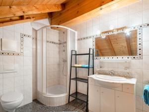 a bathroom with a shower toilet and a sink at Apartment Lore - SOE 301 by Interhome in Sölden