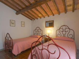 A bed or beds in a room at Holiday Home Cellole - Valluccia by Interhome