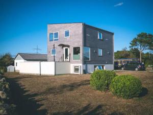 a house with a car parked in front of it at Comfortable apartment, 10min Airport in Stavanger