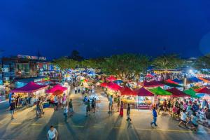 a crowd of people walking around a market at night at Elegant room near beaches, shopping, restaurant​s in Phuket Town