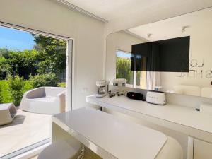 a bathroom with a white counter and a sink at Holiday Home House Boat Small by Interhome in San Teodoro