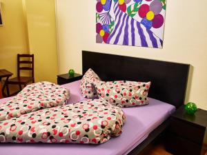 a bed with two pillows and a painting of a zebra at Apartment Residence Awen-1 by Interhome in Neustift im Stubaital